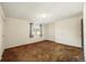 Comfortable bedroom with neutral paint, carpet flooring, and ample natural light at 4445 S Lowell Blvd, Denver, CO 80236