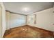 Large bedroom with neutral paint and carpet flooring with an oversized window at 4445 S Lowell Blvd, Denver, CO 80236