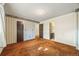 Primary bedroom leading to on-suite bathroom and and closets at 4445 S Lowell Blvd, Denver, CO 80236