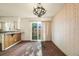 Cozy dining area with wood floors and sliding glass doors leading to the backyard at 4445 S Lowell Blvd, Denver, CO 80236