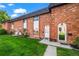 Charming brick townhomes with well-manicured lawns and inviting front entrances at 4445 S Lowell Blvd, Denver, CO 80236