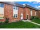 Charming brick townhomes with well-manicured lawns and inviting front entrances at 4445 S Lowell Blvd, Denver, CO 80236