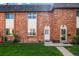 Charming brick townhomes with well-manicured lawns and inviting front entrances at 4445 S Lowell Blvd, Denver, CO 80236