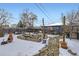 Large backyard with garden and stone path, winter view at 543 S Bryant St, Denver, CO 80219