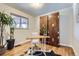 Bright bedroom featuring hardwood floors and built-in storage at 543 S Bryant St, Denver, CO 80219