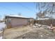 Detached garage with single door, winter view at 543 S Bryant St, Denver, CO 80219