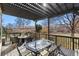 Spacious backyard deck perfect for entertaining, featuring a pergola and seating area at 8656 Aberdeen Cir, Highlands Ranch, CO 80130