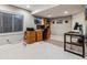 Basement office with two workstations and ample storage at 8656 Aberdeen Cir, Highlands Ranch, CO 80130