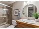 Clean bathroom with a shower, toilet, and a vanity with a sink at 8656 Aberdeen Cir, Highlands Ranch, CO 80130