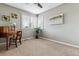 Bright bedroom with carpeted floor, window seating, and neutral walls at 8656 Aberdeen Cir, Highlands Ranch, CO 80130