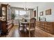 Formal dining room with hardwood floors and large window at 8656 Aberdeen Cir, Highlands Ranch, CO 80130