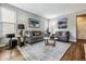 Spacious living room with hardwood floors and ample natural light at 8656 Aberdeen Cir, Highlands Ranch, CO 80130