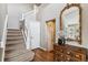 Elegant staircase with hardwood floors and a light-colored railing at 8656 Aberdeen Cir, Highlands Ranch, CO 80130