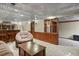 Finished basement with bar, built-in shelving, paneled walls, and decorative ceilings at 455 Greenwood, Longmont, CO 80504