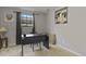 Neutral-toned room with a black work desk, artwork, and a window providing natural light at 455 Greenwood, Longmont, CO 80504