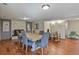 Inviting dining room featuring a fireplace, large table, and modern lighting, perfect for Gathering gatherings at 455 Greenwood, Longmont, CO 80504