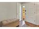 Inviting entryway with a tiled floor, a cushioned bench, and a bright white front door at 455 Greenwood, Longmont, CO 80504