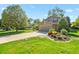 Beautiful home with a well-kept lawn and colorful garden beds accentuating the driveway at 455 Greenwood, Longmont, CO 80504