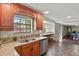 Spacious kitchen featuring wooden cabinets, granite countertops, and stainless steel appliances at 455 Greenwood, Longmont, CO 80504