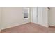 Bedroom featuring neutral walls, carpeted floors, and a window with horizontal blinds at 47341 Lily Ave, Bennett, CO 80102