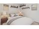 Bedroom featuring decor shelves and a neutral color scheme at 47341 Lily Ave, Bennett, CO 80102