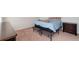 Bedroom with carpet floors and furnishings, including a bed and nightstand at 47341 Lily Ave, Bennett, CO 80102