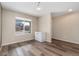 Bright dining room offering a window view and sleek, modern flooring at 47341 Lily Ave, Bennett, CO 80102