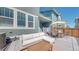 Enjoy outdoor living on this backyard patio, complete with comfortable seating, dining area, and fenced yard at 9095 Birch Run Ln, Parker, CO 80134