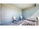 This outdoor space is the perfect place to relax, featuring two rocking chairs and an outdoor grill at 9095 Birch Run Ln, Parker, CO 80134