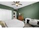 Cozy bedroom with green walls, a ceiling fan, and carpeted floors at 6780 Meade Cir # B, Westminster, CO 80030