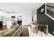 Living room leading to modern kitchen and dining area at 6780 Meade Cir # B, Westminster, CO 80030