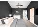 Main bedroom featuring dark gray walls, neutral carpet, and decorative furnishings at 6780 Meade Cir # B, Westminster, CO 80030