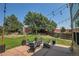 Inviting backyard with a paver patio, comfortable seating, fire pit, landscaping and decorative string lights at 6769 W 70Th Ave, Arvada, CO 80003
