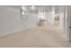 Finished basement with carpet, white walls, and a bar area with an opening to another room at 6769 W 70Th Ave, Arvada, CO 80003