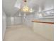 Finished basement with carpet, white walls, light fixtures, and a bar area at 6769 W 70Th Ave, Arvada, CO 80003