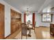 Elegant dining room with hardwood floors, chandelier, and custom built-in cabinetry at 6769 W 70Th Ave, Arvada, CO 80003