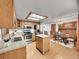 Modern kitchen with stainless steel appliances, granite countertops, and breakfast bar, with open dining area at 6769 W 70Th Ave, Arvada, CO 80003