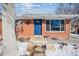 Inviting blue front door entry to a brick ranch home at 3345 W Aqueduct Ave, Littleton, CO 80123