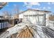 Two-car detached garage with snow on the ground at 3345 W Aqueduct Ave, Littleton, CO 80123