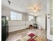 Finished basement with laminate flooring, plenty of natural light, and a fish tank at 2829 W College Ave, Denver, CO 80219