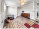 Bright room featuring sleek wood floors, neutral walls, ceiling fan and abundant storage at 2829 W College Ave, Denver, CO 80219