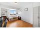 Comfortable bedroom with natural light, floating shelves, hardwood floors, and ample closet space at 800 N Washington St # 710, Denver, CO 80203