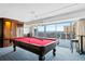 Enjoy a game room with a pool table, stylish furniture, and city views through large windows at 800 N Washington St # 710, Denver, CO 80203