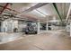A well-lit parking garage with painted ceilings and a designated parking space at 800 N Washington St # 710, Denver, CO 80203