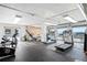 Modern building gym equipped with treadmills, bikes, weights, and views of the city and the mountains at 800 N Washington St # 710, Denver, CO 80203