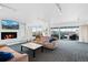 Open-concept living room featuring a cozy fireplace, comfortable seating, and a large window to the city at 800 N Washington St # 710, Denver, CO 80203