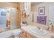 Clean bathroom features tile flooring, shower, and vanity with sink at 12 Canon Cir, Greenwood Village, CO 80111