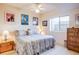 Comfortable bedroom with ample natural light, wood floors, and cozy atmosphere at 12 Canon Cir, Greenwood Village, CO 80111