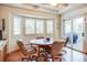 Breakfast nook area with lots of windows and natural light, features a hardwood floor and sliding glass door at 12 Canon Cir, Greenwood Village, CO 80111