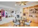 Cozy dining area with glass table, built-in shelving, and a view of the staircase at 12 Canon Cir, Greenwood Village, CO 80111